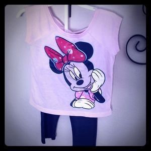 Minnie Mouse tshirt and dark blue jeggings.